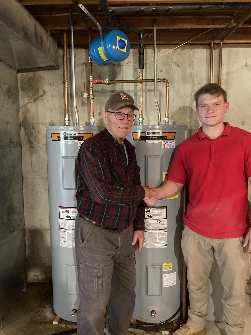 Plumbing technician shaking hands with a happy homeowner after a same-week install